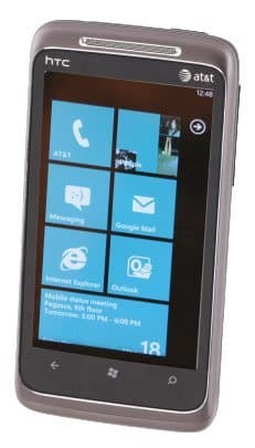 HTC Surround smartphone front view displaying Windows Phone home screen with live tiles and AT&T branding