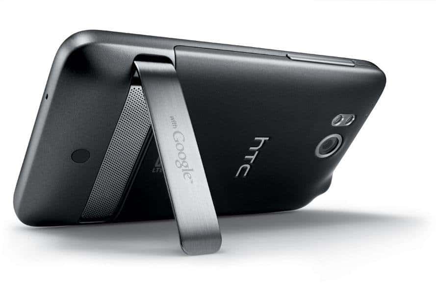Rear view of black HTC ThunderBolt with extended metal kickstand ("with Google"), rear camera, and speaker visible.