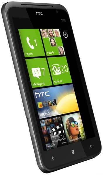 HTC Titan front view showing Windows Phone home screen with green tiles for Phone, People, Messaging, Outlook, and apps below