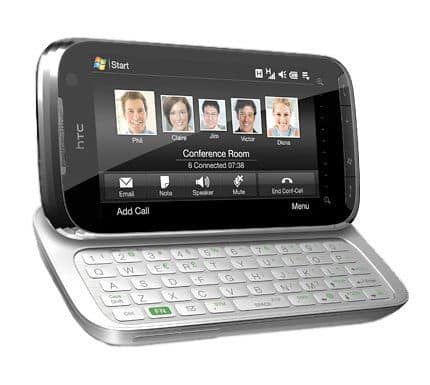 Front view of silver HTC Touch Pro2 with slide-out QWERTY keyboard, showing touchscreen conference call with six participants.