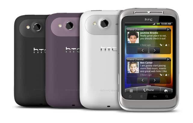 HTC Wildfire S front and rear views in black, purple, and white, displaying social media notifications on screen