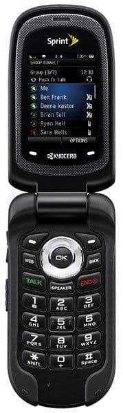 Kyocera DuraCore flip phone, open position, showing contacts list on upper screen and numeric keypad below with Sprint branding