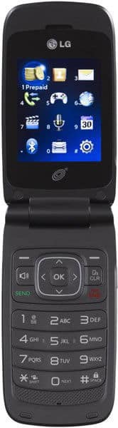 LG 235C flip phone, open, showing blue home screen with app icons and numeric keypad below
