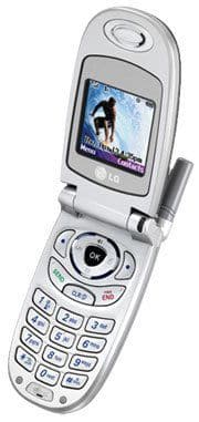 LG 3280 flip phone, open, displaying image on screen with numeric keypad visible below