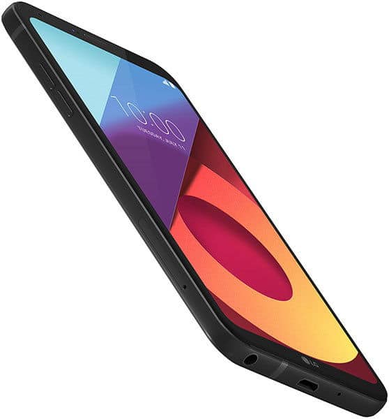 Black LG Q6 smartphone from a low angle, slim side profile shown. Screen displays 10:00, red and purple hues; ports visible.