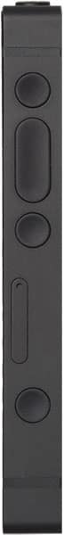Light Phone III rear view, showing vertical arrangement of circular camera lens, speaker grille, and button details on dark matte surface