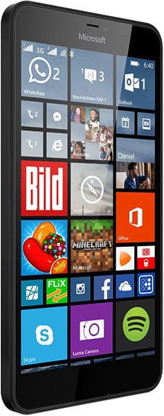 Microsoft Lumia 640 XL front view, displaying home screen with colorful app tiles including WhatsApp, Outlook, Bild, Office, Minecraft, Facebook, and Spotify