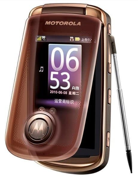 Motorola Ming A1680 flip phone, open front view, displaying time and date on screen with stylus extended