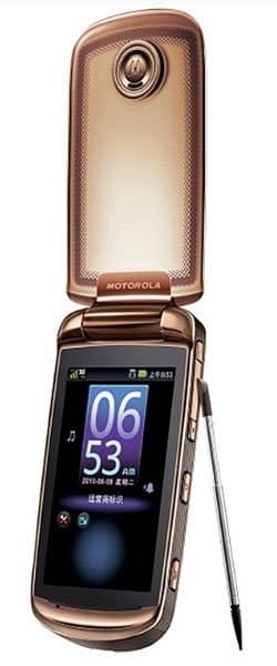 Motorola Ming A1680 flip phone, open, displaying purple screen with time and date, stylus extended from side