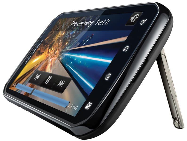 Motorola Photon 4G front view with kickstand extended, displaying video player app on screen