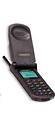 Motorola StarTAC 7868 flip phone shown open, displaying screen and keypad in black and green