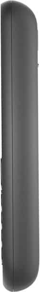 Nokia 130 (2017) side view, showing narrow dark gray candybar phone body with curved edges and side buttons