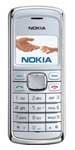 Nokia 2135 mobile phone, front view, showing silver body with small screen displaying menu, numeric keypad, and antenna