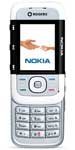 Nokia 5300 XpressMusic phone, front view, with silver body, small screen displaying Nokia branding, and numeric keypad below