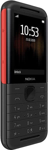 Nokia 5310 (2020) front view, black with red accents, displaying time and date on screen with physical keypad below