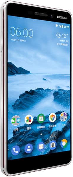Nokia 6 (2018) front view with screen displaying home screen, apps, and mountain landscape wallpaper