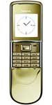 Nokia 8800 Sirocco Gold Edition, front view, showing gold-toned metal casing, display screen with time, and numeric keypad