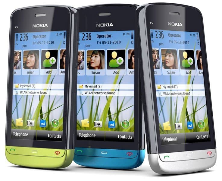Nokia C5-03 phones in lime green, cyan blue, and silver, displayed front-facing with home screens showing contacts and notifications
