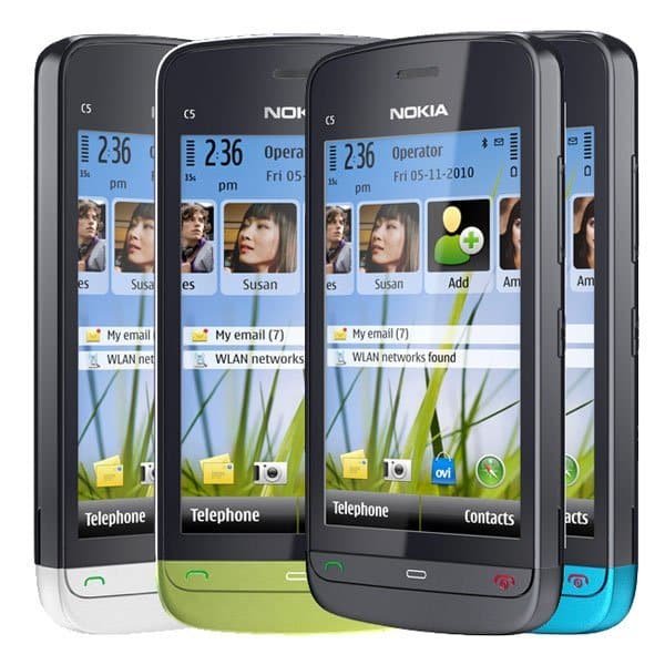 Nokia C5-04 smartphones in white, green, gray, and blue, displayed front-facing showing home screens with contacts and messaging apps