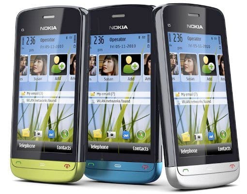 Nokia C5-04 front view in three color variants: lime green, blue, and silver, each displaying home screen with contacts and messaging icons