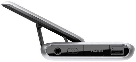 Side view of Nokia E7 with screen partially open, revealing HDMI, USB, audio jack ports, and the hinge mechanism.