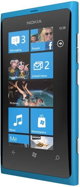 Front view of blue Nokia Lumia 800 showing Windows Phone home screen with app tiles and time 12:38 in top right corner.