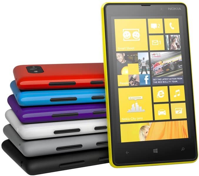 Nokia Lumia 820 in yellow with Windows Phone home screen, displayed with stacked color variants including red, blue, purple, white, and black