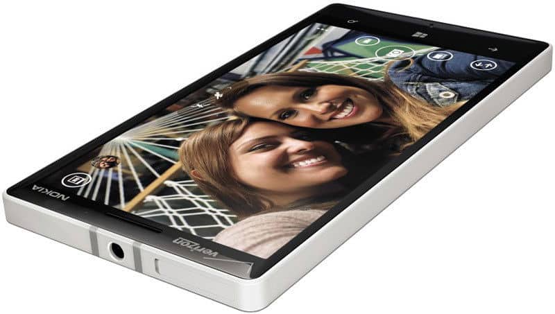 Nokia Lumia Icon front view displaying home screen with photo of two smiling people and app icons along the top