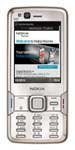 Nokia N82 phone front view, silver with screen displaying web content and numeric keypad below