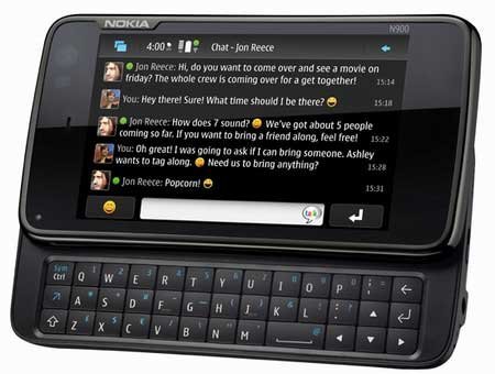 Nokia N900 front view with touchscreen displaying messaging app and slide-out QWERTY keyboard visible below