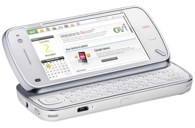 Nokia N97 NAM smartphone shown open with slide-out QWERTY keyboard visible and touchscreen displaying web browser interface