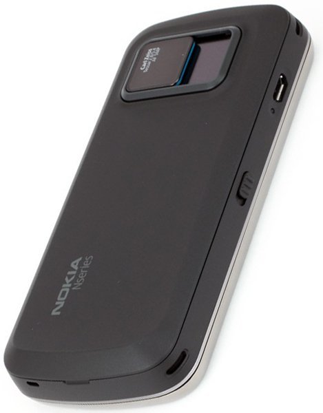 Nokia N97 NAM rear view showing dark grey casing with camera lens and Nokia branding on back
