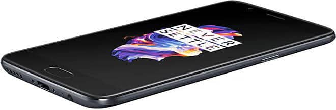 OnePlus 5 phone displayed at an angle, showing the screen with colorful logo and text against a black background