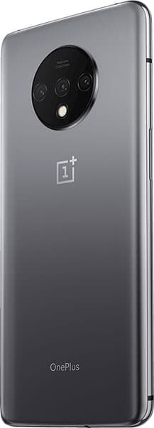 Rear view of matte gray OnePlus 7T with circular triple camera, flash, and OnePlus branding at center and bottom.
