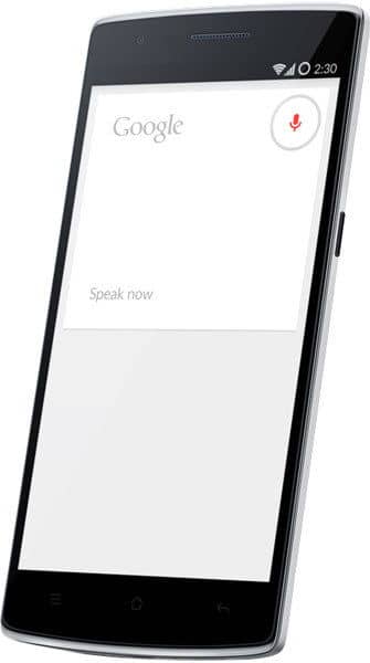 OnePlus One front view displaying Google Search interface with microphone icon and "Speak now" prompt on screen