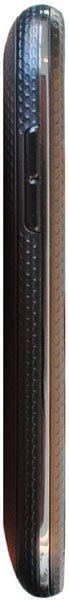 Pantech Pocket mobile phone, side view, showing narrow rectangular shape with textured dark surface and blue-lit keypad