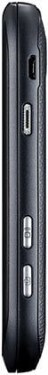 Side view of black Pantech Vybe featuring two silver buttons and micro USB and mini USB ports on a textured surface.