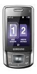 Samsung B5702 mobile phone, front view, showing purple display screen and numeric keypad