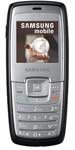 Samsung C140 mobile phone, front view, displaying screen with image and numeric keypad below