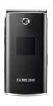 Samsung E210 flip phone, closed position, front view showing black exterior and silver trim