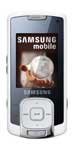 Samsung F330 mobile phone, front view, silver and black candybar design with screen displaying clock and date