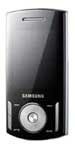 Samsung F406 mobile phone, front view, displaying silver and black casing with round navigation dial