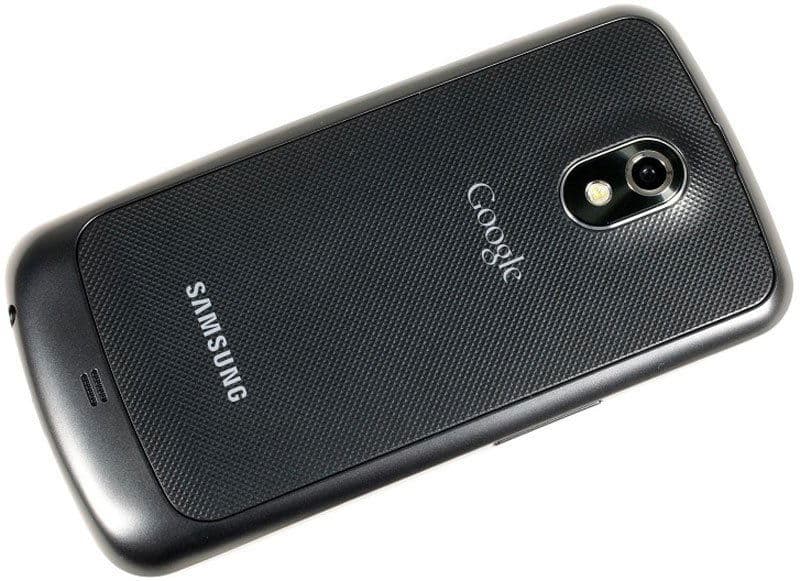 Samsung Galaxy Nexus rear view, black textured back with Samsung and Google branding, dual-lens camera with flash