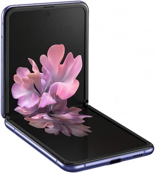 Samsung Galaxy Z Flip open, displaying pink flower wallpaper on folded screen against dark background