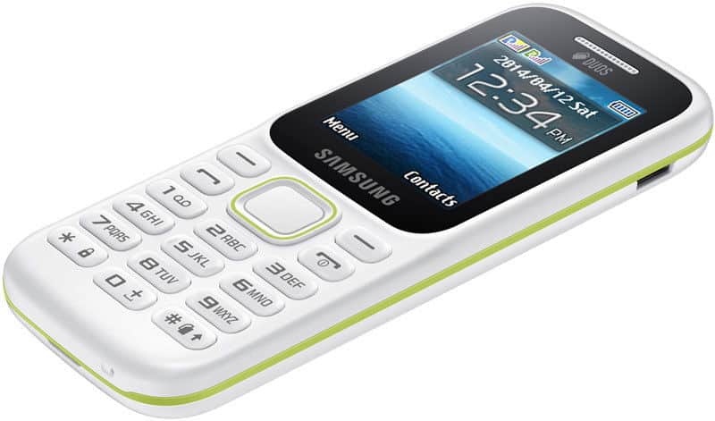 Samsung Guru Music 2 front view, white phone with green accent stripe, small screen, and numeric keypad with music controls