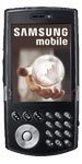 Samsung SCH-i760 phone, front view, with dark screen and silver rotary dial and button controls below