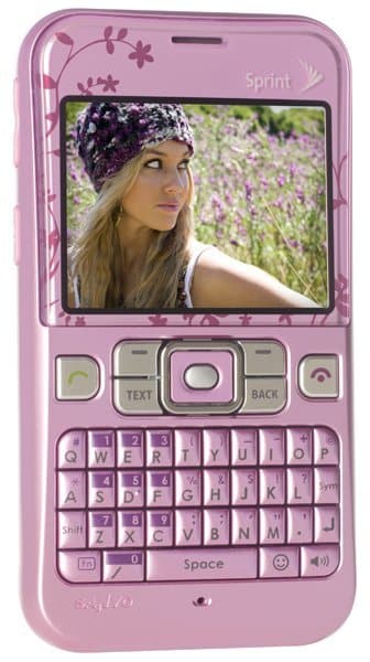 Sanyo Juno pink flip phone, front view with display showing woman in flower field and QWERTY keyboard below