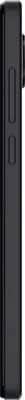 Schok Volt SV67Q phone shown from the side, displaying its slim black profile and textured back panel