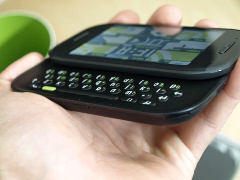 Sharp Kin Two held in hand, showing touchscreen display and slide-out QWERTY keyboard, front view
