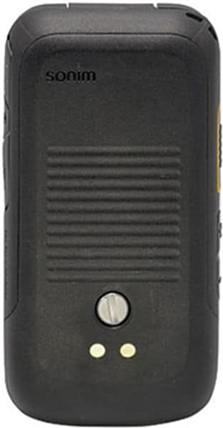 Rear view of black Sonim XP3 showing ribbed center, two circular lights, and small silver button—rugged mobile phone design.